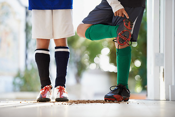 Image showing Soccer player, friends and cleats or sports athlete with dirt in home or competition game, workout or training. People, legs and fitness fit in house or football exercise as youth, cardio or practice
