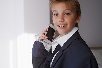 Image showing Child, portrait and phone call in suit for communication connection or dress up costume, home or working. Male person, face and smartphone conversation in apartment for corporate, talking or happy