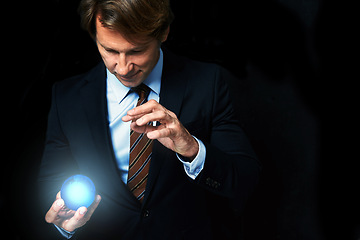 Image showing Businessman, globe and hologram for networking, global expansion and worldwide innovation in studio. Futuristic crystal, magic and professional man on black background, tech and connect for economy