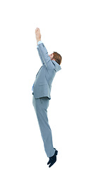 Image showing Studio, professional and businessman jump for goal of promotion or upgrade of job or career. White background, male person and employee ready for opportunity in workplace for achievement in startup