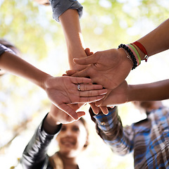 Image showing Hands, friends and people for teamwork, collaboration and community outdoor in nature, environment and park from below view. Group, diversity and huddle together for support, solidarity and unity