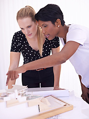 Image showing Model, blueprint or people with engineering teamwork for development project or planning on paper. Architecture, women or group of designers talking in collaboration for floor plan of office building