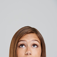 Image showing Studio, head and closeup with eyes, thinking and mockup for idea or vision. Woman, planning and memory with optimism, positive and hopeful for future contemplating isolated on white background