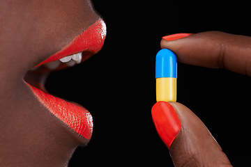 Image showing Woman, lipstick and beauty with pill for health, supplement with nail polish and bright makeup color on black background. Collagen, medicine and tablet for cosmetic care, orange lip balm and manicure