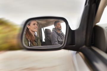 Image showing Couple, car and mirror on roadtrip with travel for adventure, vacation and reflection with happiness in countryside. Woman, man and driving in transport for holiday journey, tourism or honeymoon trip