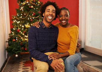 Image showing Couple, portrait and Christmas holiday at tree in apartment for bonding celebration with decoration, connection or lights. Man, woman and face in living room for festive season, gifts or marriage