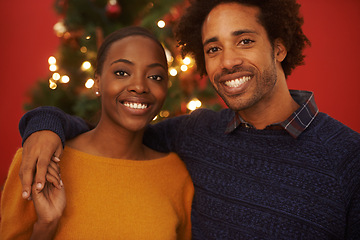 Image showing Christmas, tree and portrait of black couple with love in home on holiday or hug on vacation with happiness. Festive, event and people embrace with care and support or excited to celebrate together