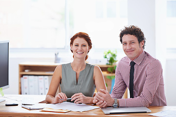 Image showing Business people, teamwork and planning at office desk for support and collaboration with financial documents. Professional accountant, advisor or man and woman with paperwork, face or happy portrait