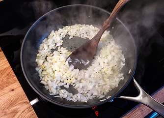 Image showing chopped onions in cooking pan