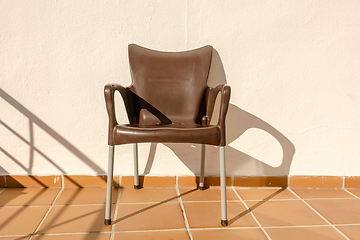 Image showing brown plastic chair on the apartment terrace