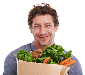 Image showing Studio, happy and portrait of man with groceries on promotion, sale or discounts deal on nutrition. Smile, delivery offer and male person with healthy food for cooking, organic fruits or diet choice