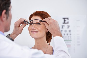 Image showing Man, optician and patient with glasses for eye exam consultation or healthy vision, retina or testing. Male person, woman and eyewear conversation for wellness checkup or advice, prescription or care