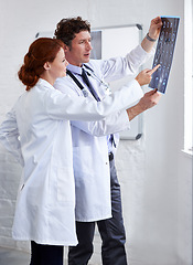 Image showing Doctors, brain scan and check results at clinic with teamwork, review and healthcare by window. Neurology, man and woman with xray reading for wellness, ideas and decision with document at hospital