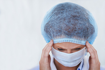Image showing Face mask, doctor and stress from surgery risk and safety gear for healthcare and medical job. Hospital, ppe and person in clinic with working and health protocol in facility with anxiety and burnout