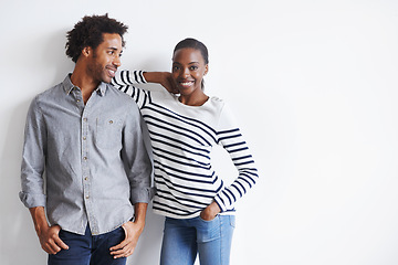 Image showing Couple, smile and portrait by white wall in fashion with confidence, casual style and model aesthetic. Black woman, and face of man with trendy apparel, edgy clothes and pride with support and relax