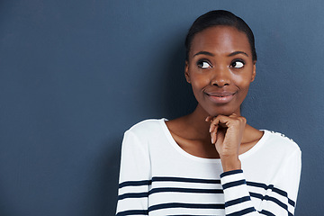 Image showing Thinking, idea and black woman with mockup in studio for planning, questions or asking on blue background. Why, curious and African female model with emoji guess for problem solving or brainstorming