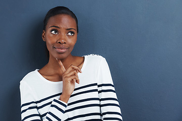 Image showing Thinking, doubt and black woman with mockup in studio for planning, questions or asking on blue background. Why, curious or African female model with emoji guess, problem solving or brainstorming