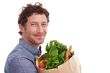 Image showing Happy man, portrait and groceries in studio for product, discount and promotion. Person, delivery offer and smile in white background for nutrition, healthy food or fruits for diet with mockup