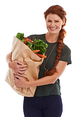 Image showing Happy woman, portrait and groceries in studio for product, discount and vegetable shopping. Person, delivery offer and smile in white background for nutrition, healthy food and fruits for diet choice