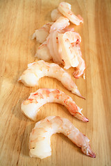 Image showing Raw prawns on chopping board