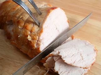 Image showing Carving boneless turkey joint