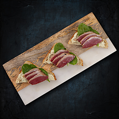 Image showing Bruschetta with slice of duck breast