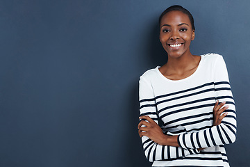 Image showing Black woman, happy and portrait in studio in fashion career and arms crossed for confident professional. African designer, face and smile for creativity as tailor by blue background and pride in job