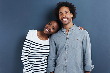 Image showing Happy, portrait and black couple hug with love on studio background together with cool fashion. African, people and smile in embrace for profile picture with casual style and clothes on mockup space