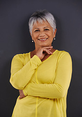 Image showing Happy, fashion and portrait of woman in studio with casual, trendy and bright tshirt for outfit. Confident, smile and senior female person from Mexico with cool style isolated by black background.