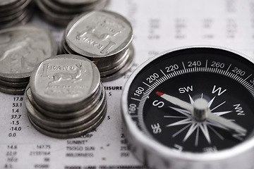 Image showing Coins, compass and business section of newspaper for exchange rate and direction on stock market for investor. Information, money and illustration of forex trading and financial indicators on paper