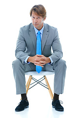 Image showing Confident businessman, sitting and studio portrait with ambition in corporate career and professional in suit. Attorney, decision and face in chair for job satisfaction and pride by white background
