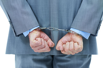 Image showing Businessman, hands and cuffs with crime for theft or corruption on a white studio background. Closeup of man or employee back tied up with chain for arrest, criminal or illegal bribery of the law