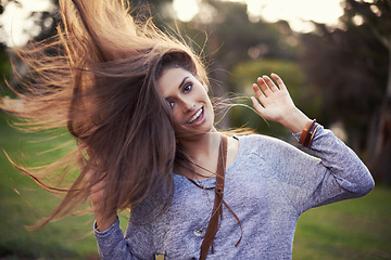Image showing Woman, freedom and smile outside with hair flip, female person in nature or creative dancing or moving motion. Summer, enjoy or student on holiday with excited, head and cheerful or vacation dancer
