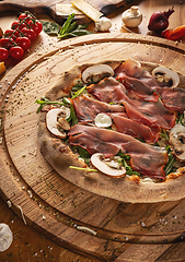 Image showing Savory pizza topped with prosciutto