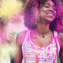 Image showing Powder, paint and woman at color festival in park, happiness and fun with celebration or party outdoor. Freedom, excited and colorful mess, smile with joy and culture, positivity and summer event