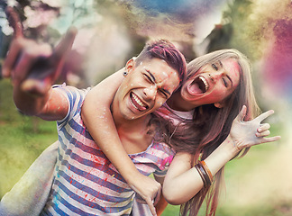 Image showing Happy, powder paint and couple portrait with rock hand sign with Holi festival and colorful event with smile. Celebration, love and excited in nature with fun people and crazy color dust for party