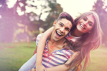 Image showing Happy, powder paint and couple of friends hug at Holi festival and colorful event with smile. Celebration, love and excited in nature with hipster people and crazy color dust for party together