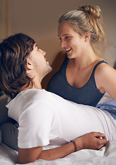 Image showing Relax, love and couple in a bed talking, bonding and resting in their home from together. Wake up, conversation and people in a bedroom with morning speaking, chat or chilling in a house on weekend