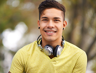 Image showing Happy, portrait and young man at skatepark for skating practice or training for competition. Smile, gen z and face of cool male person sitting on ramp with positive, good and confident attitude.