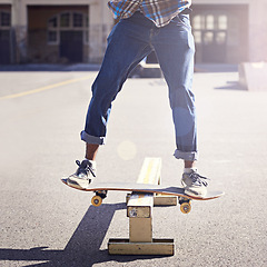 Image showing Skatepark, balance and man with riding skateboard for technique, skill and trick in recreation activity. Skateboarder, lens flare and male person for training, competition or hobby in city of Atlanta