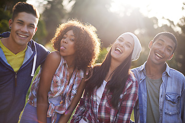 Image showing Friends, portrait and smile in nature for adventure, vacation and weekend break in outdoors. Happiness, lens flare and face of diverse group of people in sunshine for bonding, holiday and travel