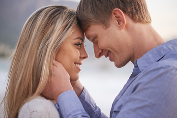 Image showing Couple, forehead and touch with smile in outdoor for love with romance in honeymoon, vacation and affection in Australia. Relationship, holiday and happy with bonding for trust, support and care