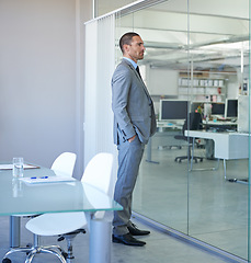Image showing Thinking, business and man at window in office planning for future decision or choice in London. Professional, entrepreneur or problem solving in conference room with expert idea or brainstorming