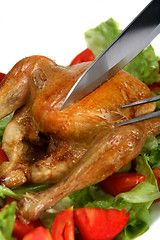 Image showing Carving a roast chicken