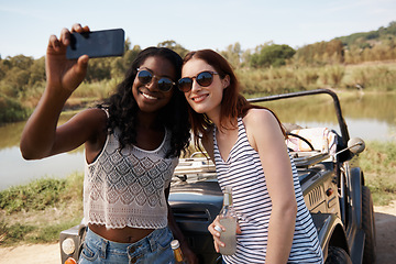 Image showing Women, selfie and vacation on road trip by lake, memory and travel adventure for social media in nature. Ladies, cellphone and profile picture in van on holiday, care and bonding together outdoor