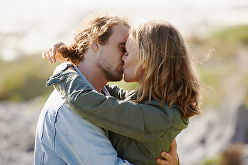 Image showing Caring, couple and kissing or hug on mountain, nature and scenery with passionate people in relationship. Love, care and embrace on romantic date, vacation or holiday in Sweden together in summer