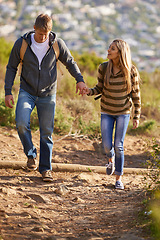 Image showing Hiking, freedom and couple in nature, happy and bonding for holiday, vacation and trip to Amsterdam. Outdoor, man and woman together for love for anniversary of girl and male person holding hands