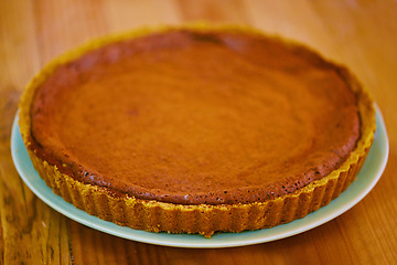 Image showing Dessert, pastry and pumpkin pie on table for thanksgiving, celebration and festive holiday. Tradition, event and gathering for eating fresh food for tasty, delicious bakery and handmade by baker