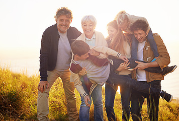 Image showing Grandparents, parents and children fun portrait in nature, spring in countryside. Exercise, kids and generations playing with child, happy in field on vacation with family together in calm outdoors