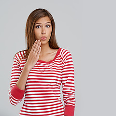 Image showing Hand, shock and portrait of woman with surprise for omg, wow or mockup isolated on gray background. Model, casual or lady for fashion, style and trendy with stripe shirt, top or outfit and expression